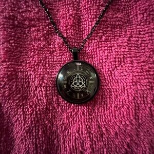 Black Pendant Necklace with Intricate Design